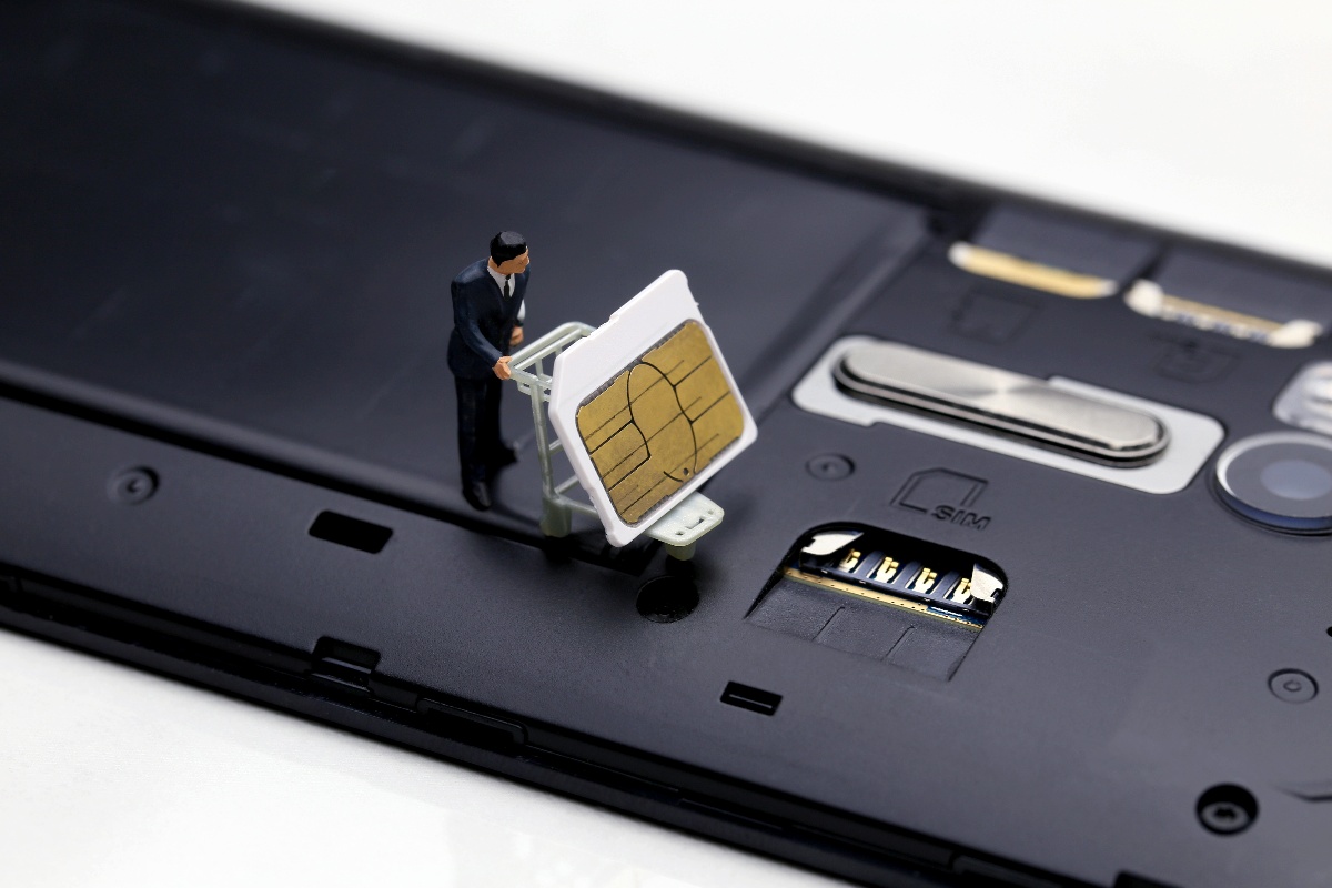 sim_swap_man_in_suit_on_phone